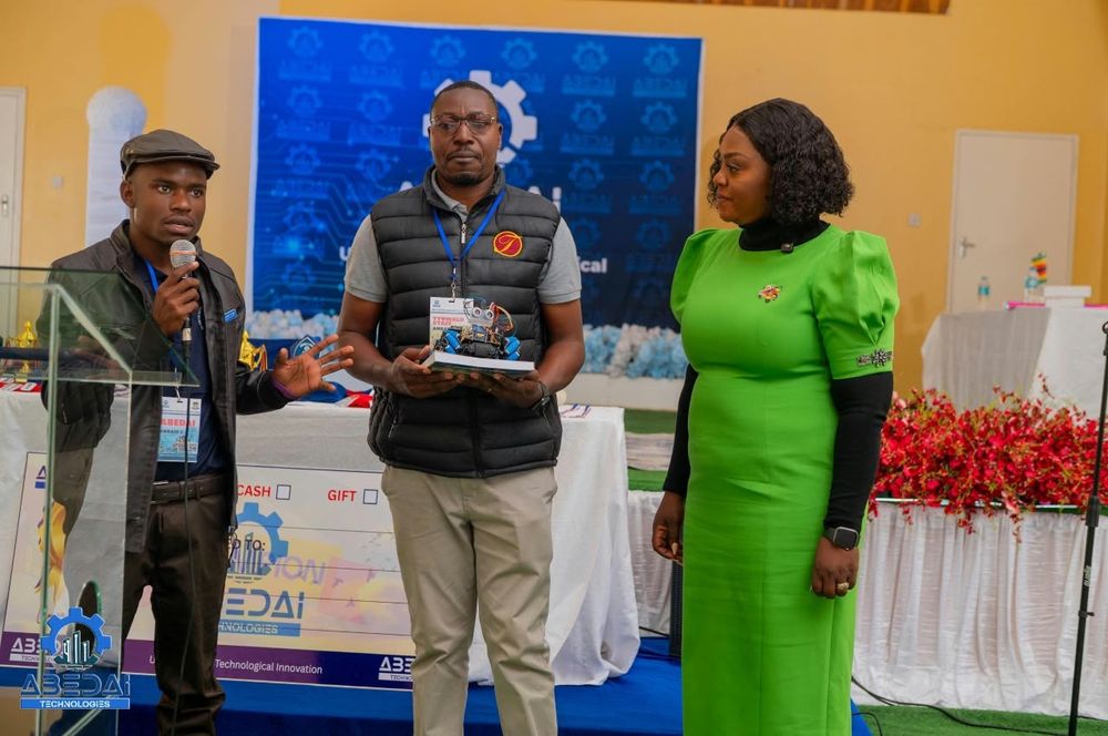 The Tynwald Primary School Coding and Robotics team receiving their award, with Zimbabwe's Minister of ICT, Postal and Courier Services